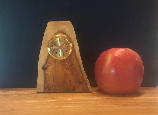 Handmade miniature clock in yew in unique design.  There is a choice of 8 different clock face colours