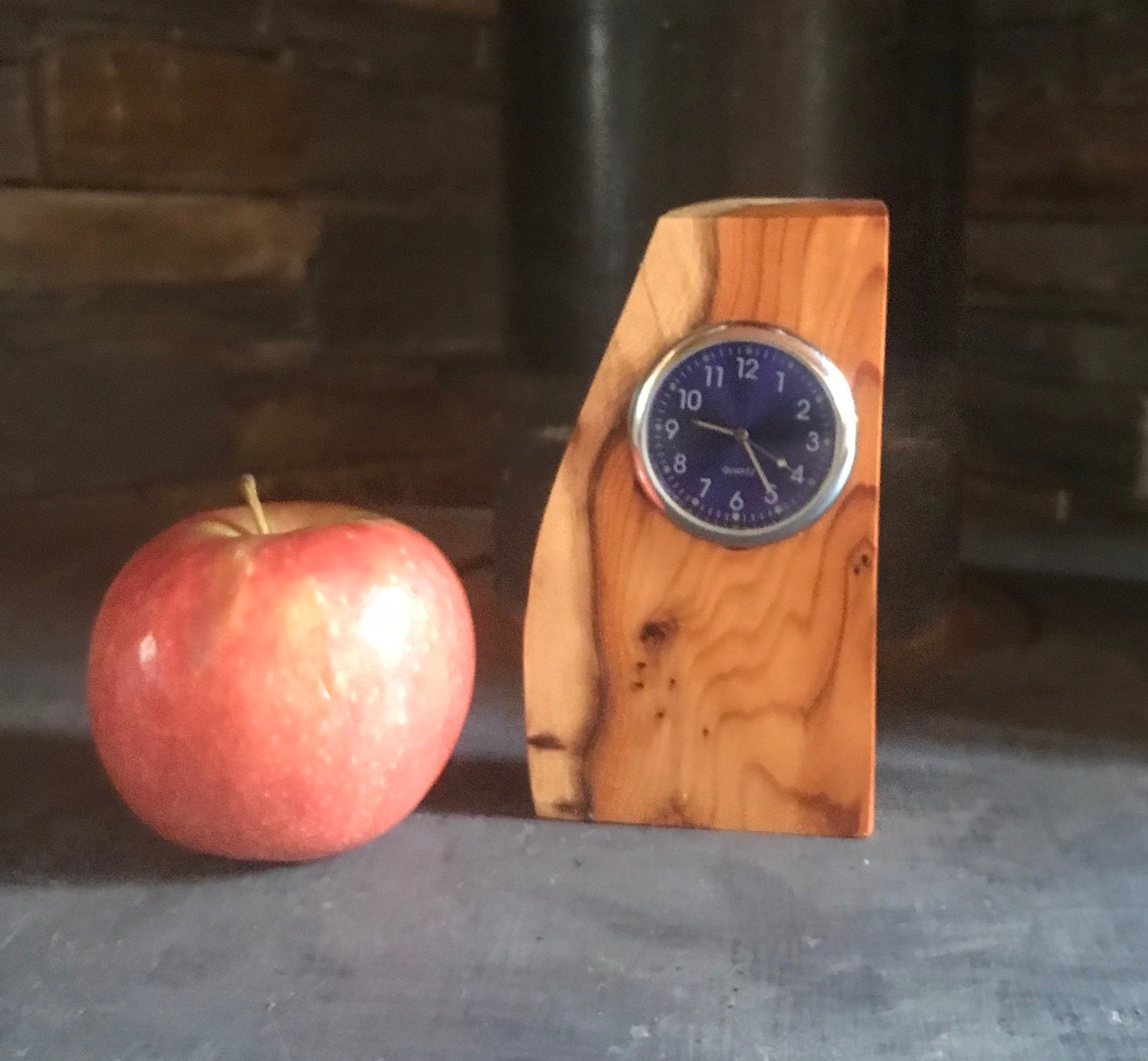 Handmade miniature clock in yew in unique design. There is a choice of 8 clock face colours