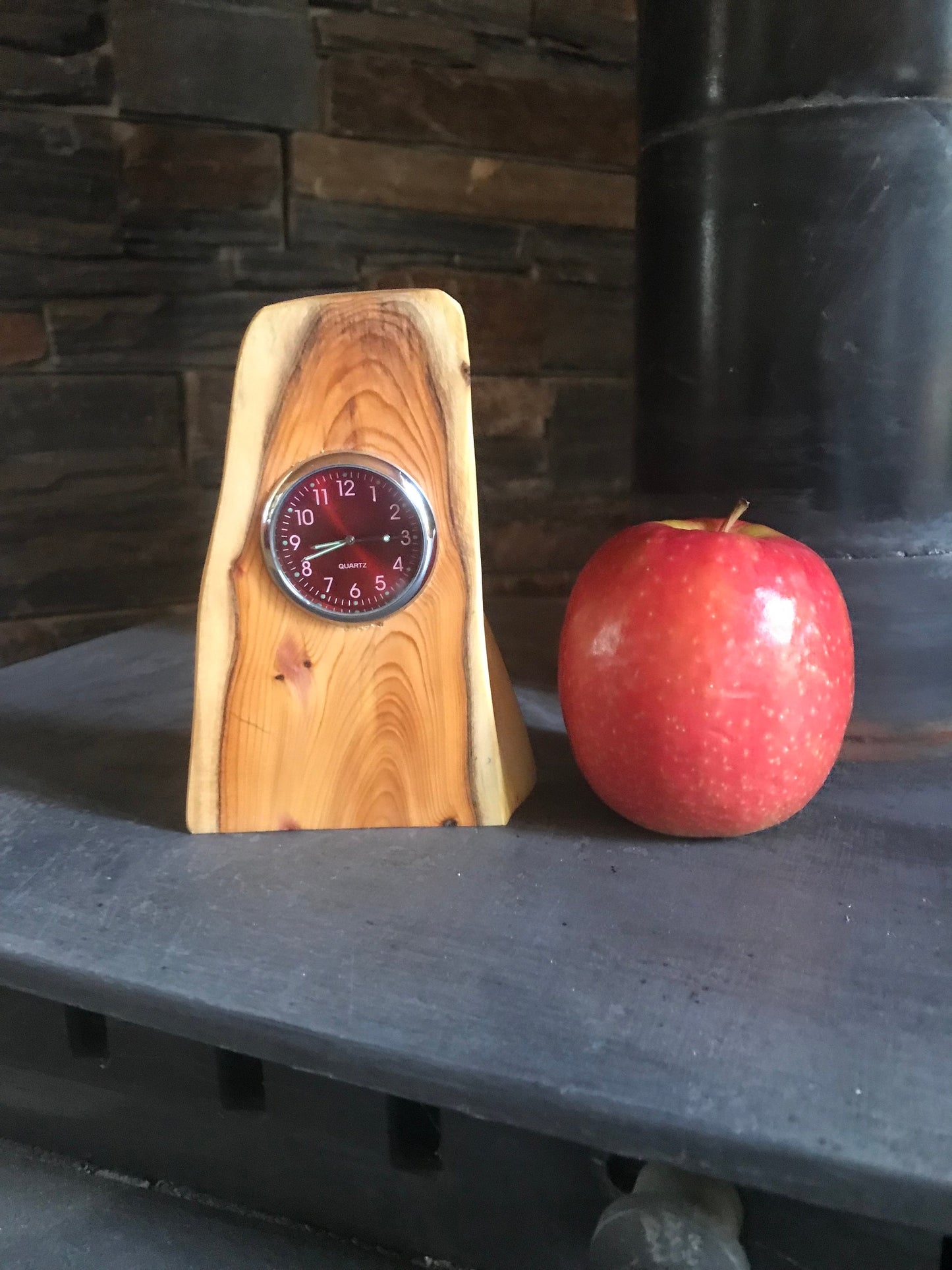 Handmade miniature clock in yew in unique design. There is a choice of 6 different clock face colours