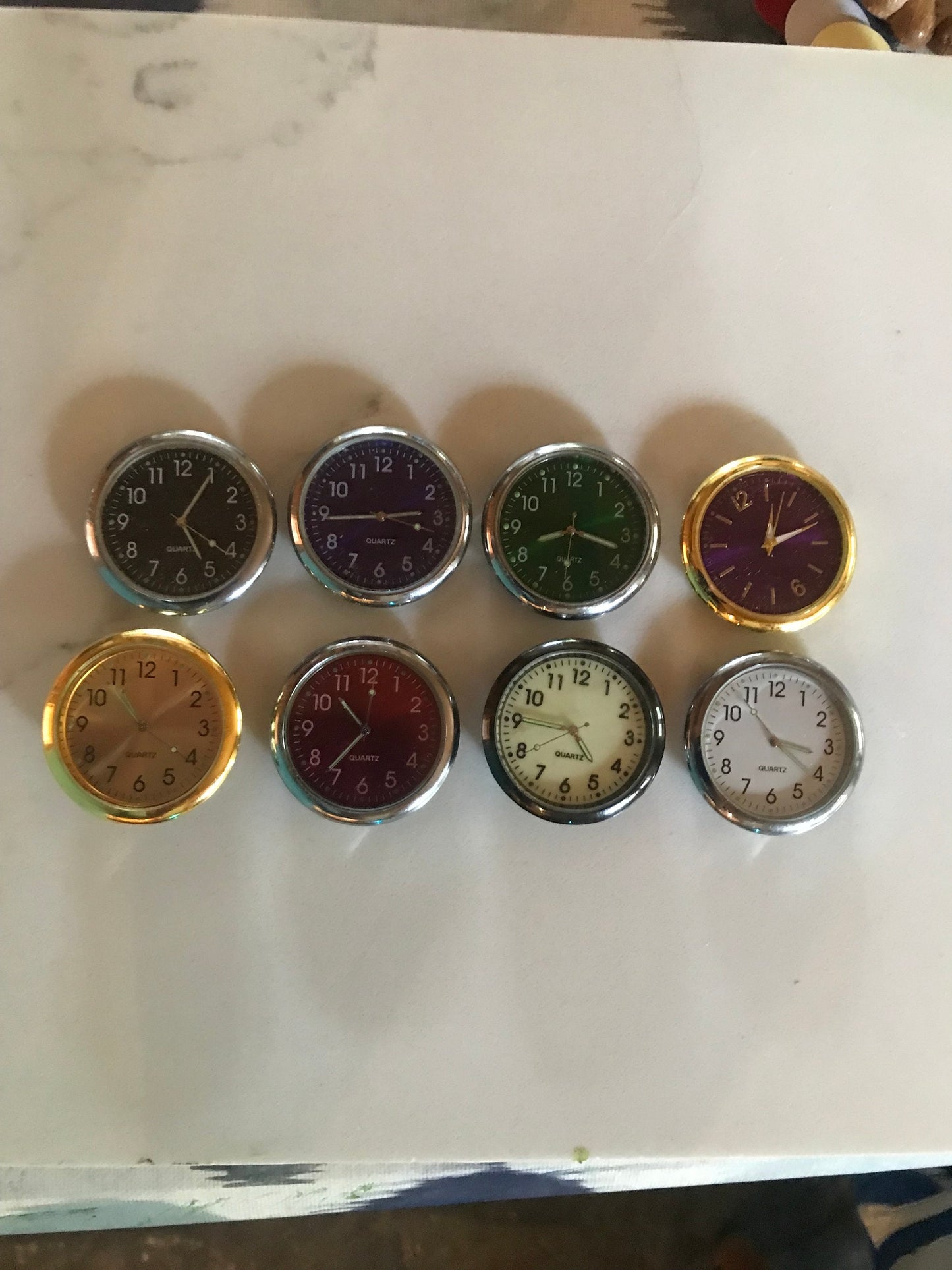 Handmade miniature clock in yew in unique design.  There is a choice of 8 clock face colours