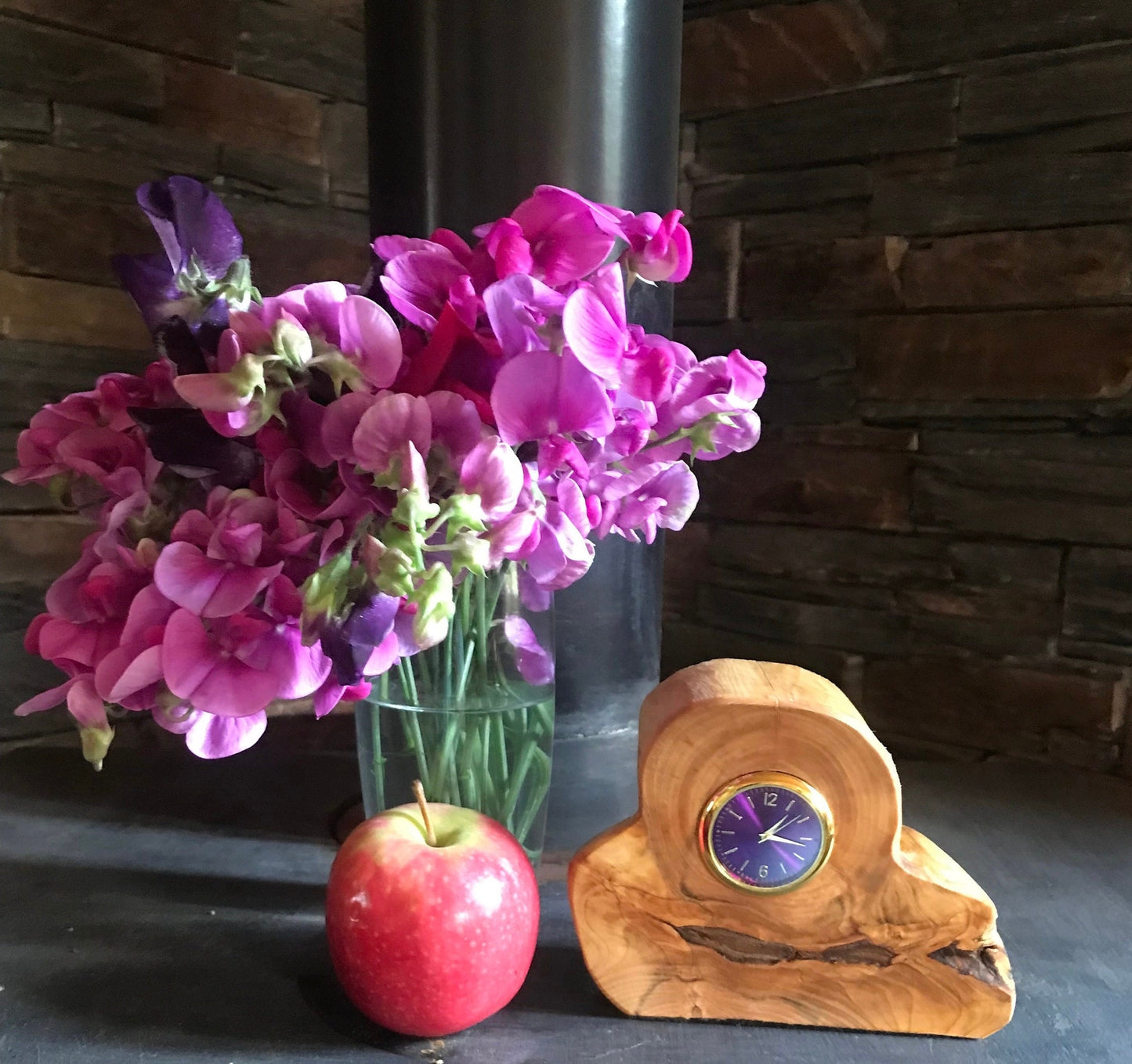 Handmade clock in Macrocarpa wood a unique design choice of 8 different clock face colours.