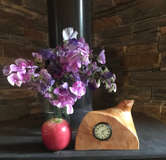 Handmade clock in Macrocarpa wood a unique design choice of 8 different clock face colours.